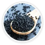 Prime Biome review: a close-up image of a wooden spoon filled with dark, tiny Babchi (Psoralea Corylifolia) seeds, a key ingredient.