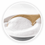 Prime Biome review: a close-up image of a wooden spoon full of white inulin powder, a prebiotic derived from chicory root.