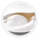 A close-up image of a wooden spoon full of white inulin powder, a prebiotic derived from chicory root.