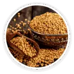 Prime Biome review: a close-up image of a wooden bowl and scoop full of small, golden fenugreek seeds, a key ingredient.